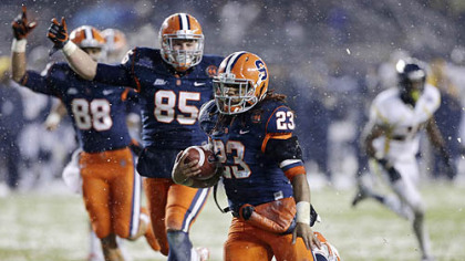 Syracuse wide receiver Jarrod West (88) and tight end Beckett Wales (85) begin to celebrate as running back Prince-Tyson Gulley (23) runs for a second-quarter touchdown against West Virginia.
