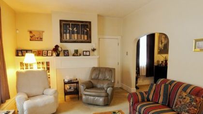 The living room at 682 Airbrake Ave., Wilmerding, features arched doorways and built-in cabinets.
