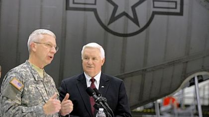 Adjutant General of Pennsylvania Wesley Craig, left, talks to the media at the 911th Airlift Wing in Moon on Friday as Gov. Tom Corbett looks on.