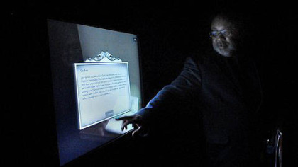 Samuel Black demonstates the interactive computer program used in the new exhibition, "From Slavery to Freedom."