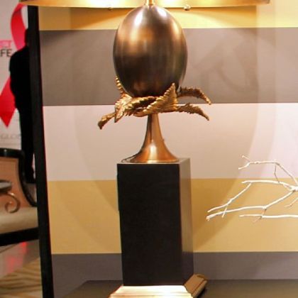 Global Views Egg and Palm lamp in brass and bronze.