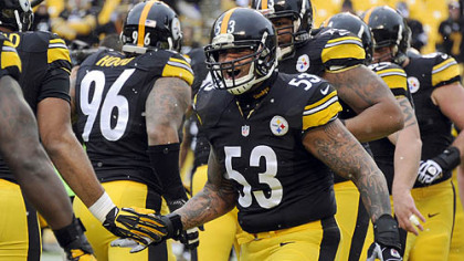 The Steelers' Maurkice Pouncey greets his teammates during warmups at Heinz Field.