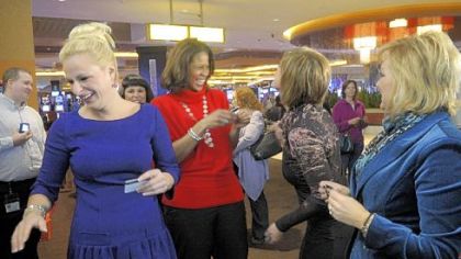 The cast of "Dance Moms," from left, Christi Lukasiak, Holly Hatcher-Frazier, Kelly Hyland and Jill Vertes, share a laugh during a news conference at the Rivers Casino.
