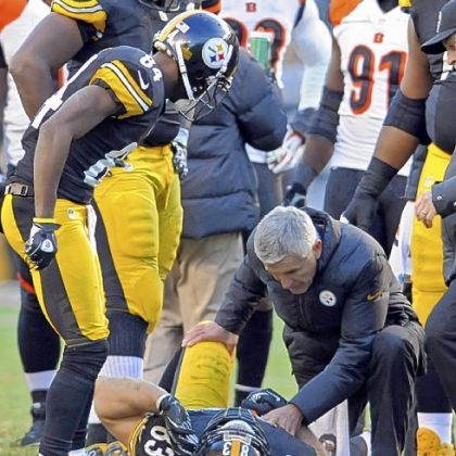 Steelers tight end Heath Miller is attended to after getting injured against the Bengals in the fourth quarter a week ago at Heinz Field.