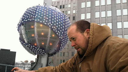 Rob Gratton, of Integrated Theater Systems, puts the final touches on preparations of "The Future of Pittsburgh" ball. It weighs approximately 1,000 pounds and is 6 feet, 7 inches in diameter and will touch a height of 74 feet above the roof of Penn Avenue Place in the 60-second countdown to the New Year of 2013.