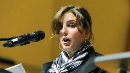 Duquesne University student Daniella Lees, a senior, reads an oral history.