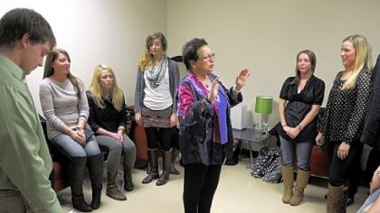 Susan Goldberg, an assistant professor at Duquesne University, has her students do deep breathing before going out to read an edited script of oral histories they recorded from Hill District residents.