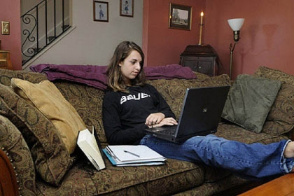 Julia Buffalini, 16, uses the family living room to take her German cyber school class.