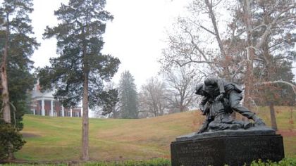Brompton, a Civil War-era house on Marye's Heights, looks down on a statue of Richard Rowland Kirkland tending to a wounded Union soldier near the site of the Battle of Fredericksburg.
