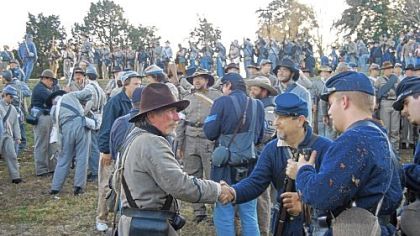 Confederate and Union soldiers shake hands after the 150th anniversary re-enactment of the Battle of Fredericksburg on Dec. 8, 2012.