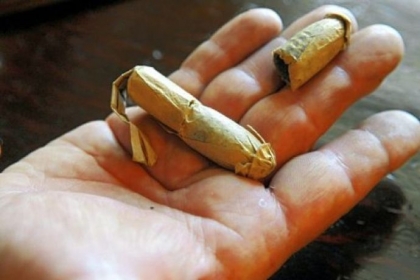 This is an example of the kind of handmade cartridge that women produced at the U.S. Allegheny Arsenal in Lawrenceville. A soldier's pack of ammunition contained 40 cartridges.